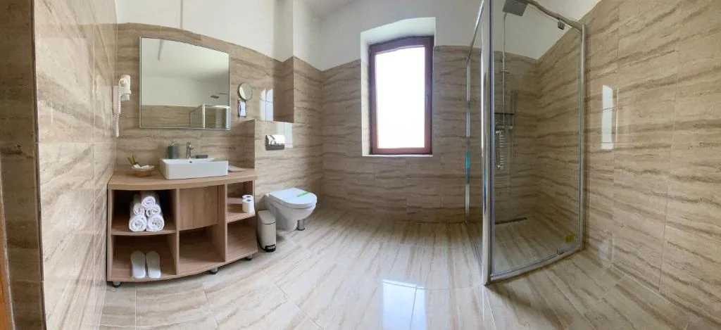 Bathroom with shower and window